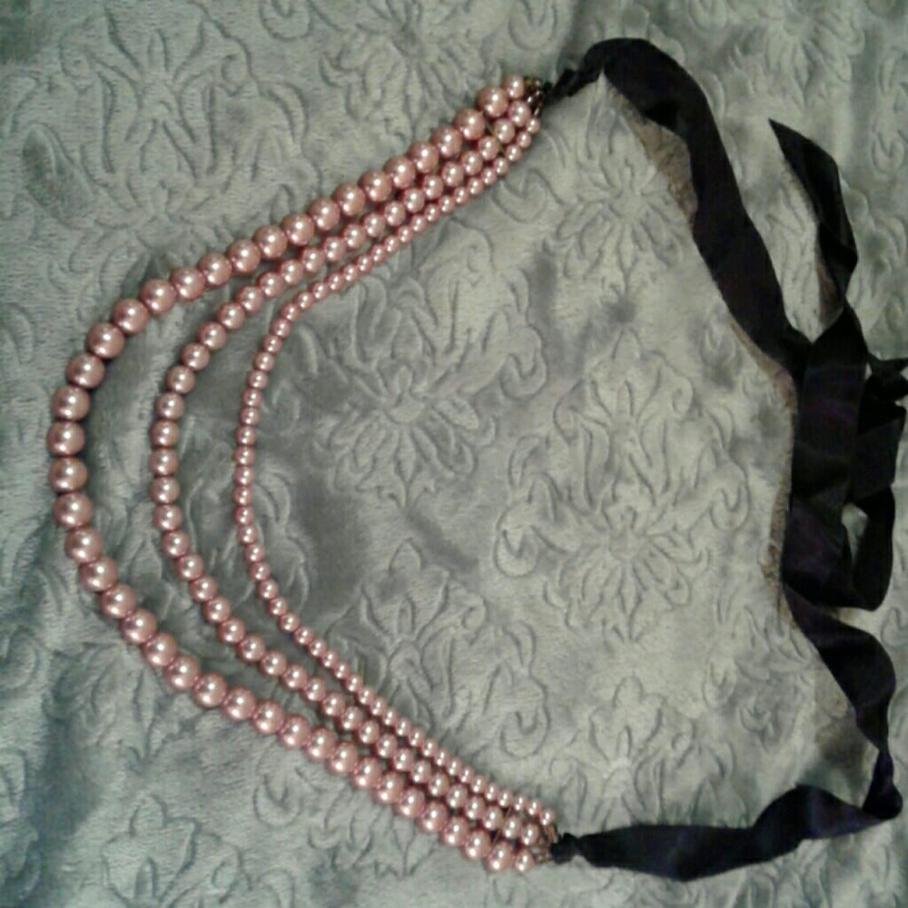 Three strand rose pearl ribbon tie necklace.